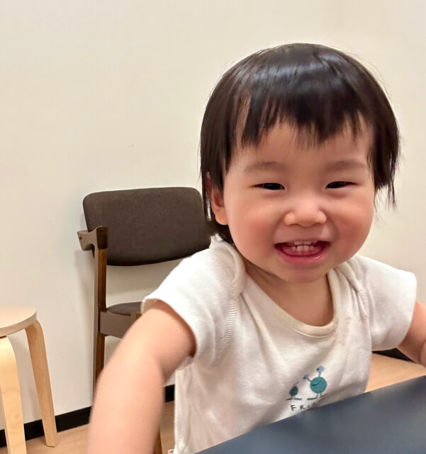 smiling baby playing
