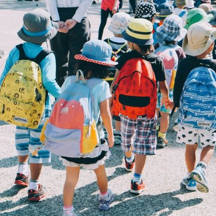 group of kids wearing backpacks