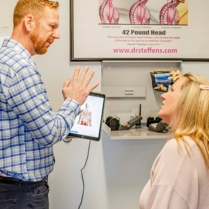 Dr John explaining findings to patient