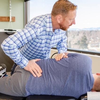 Central Park chiropractor Dr Steffens adjusting patients back