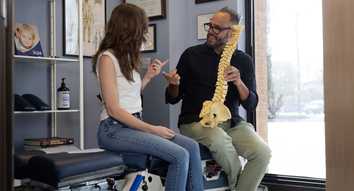 Austin chiropractor in discussion with a patient