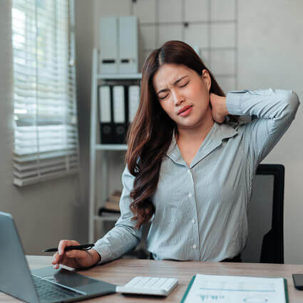 woman blue button up with neck pain
