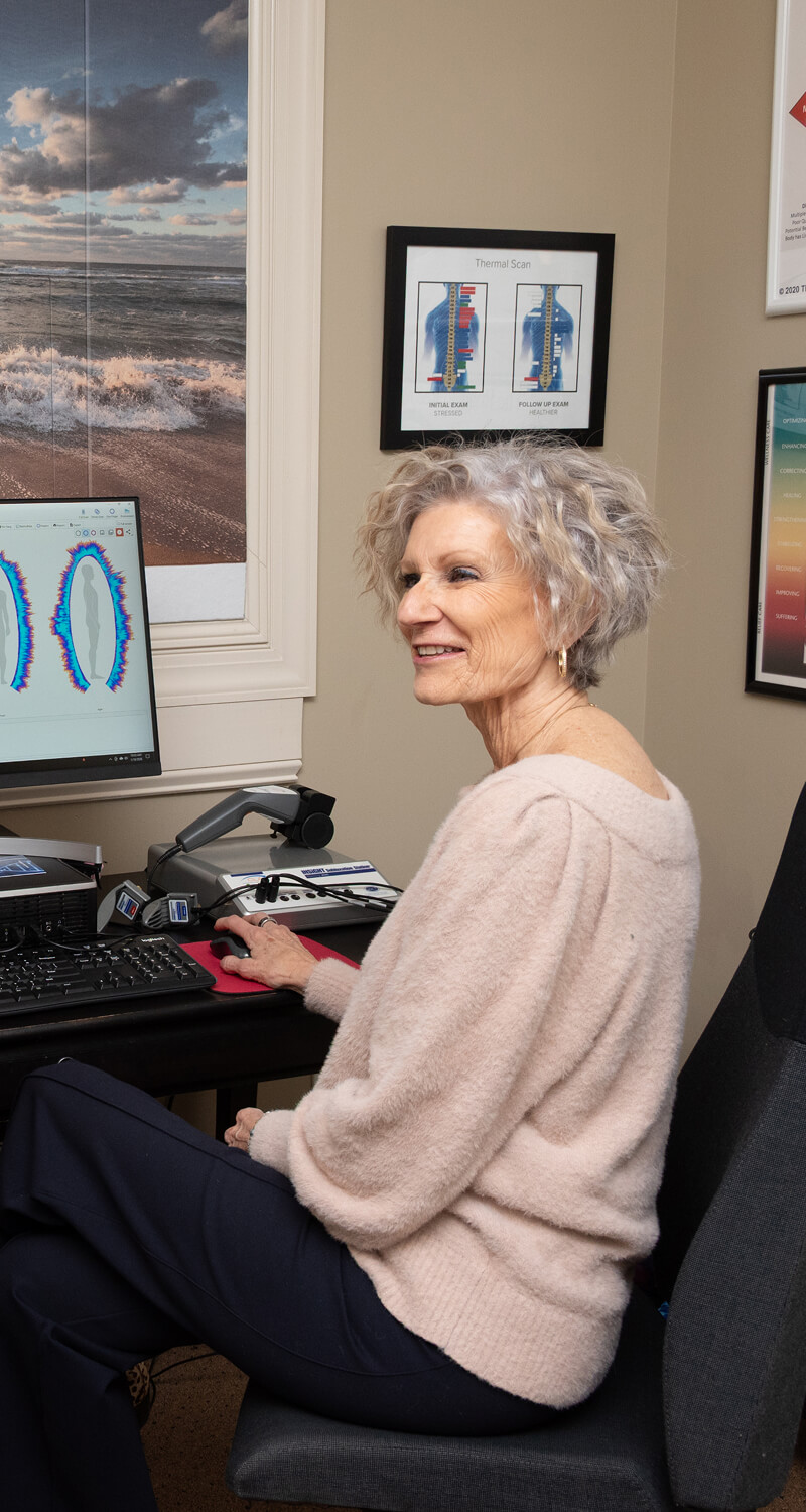 Huntersville chiropractor Dr Gross reviewing results at a computer