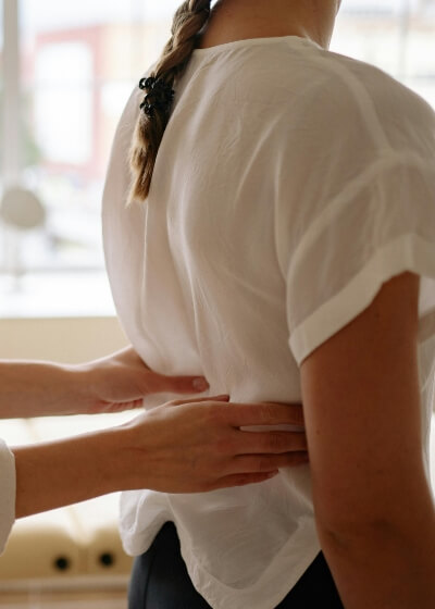 woman having back examined