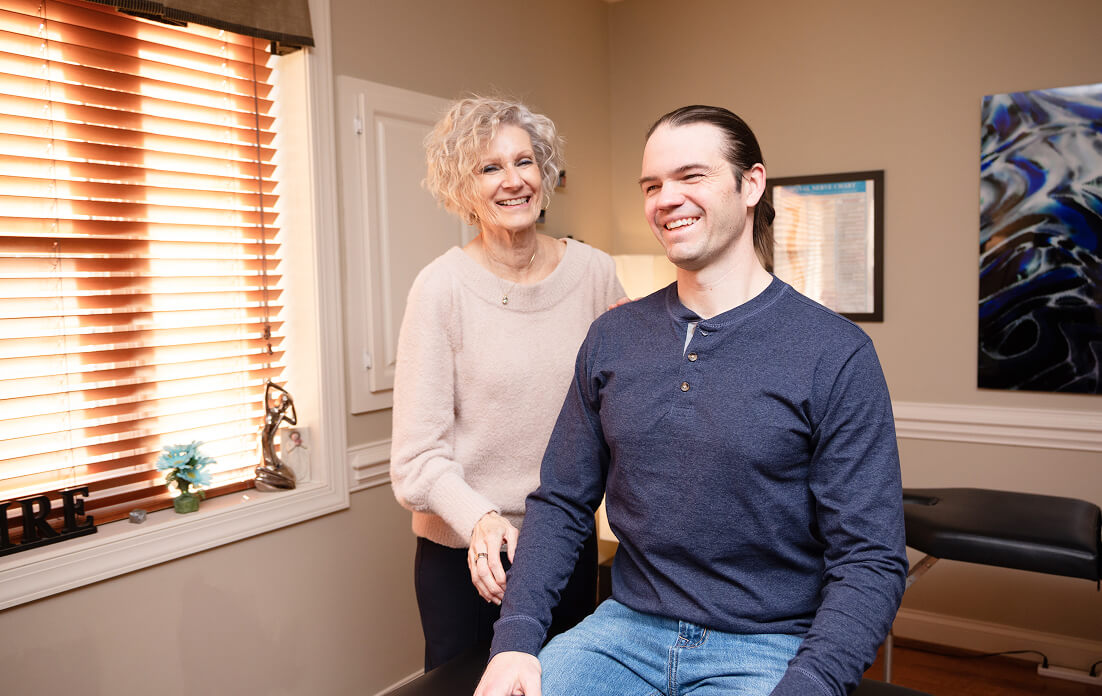 Huntersville chiropractor Dr Dinni laughing with patient