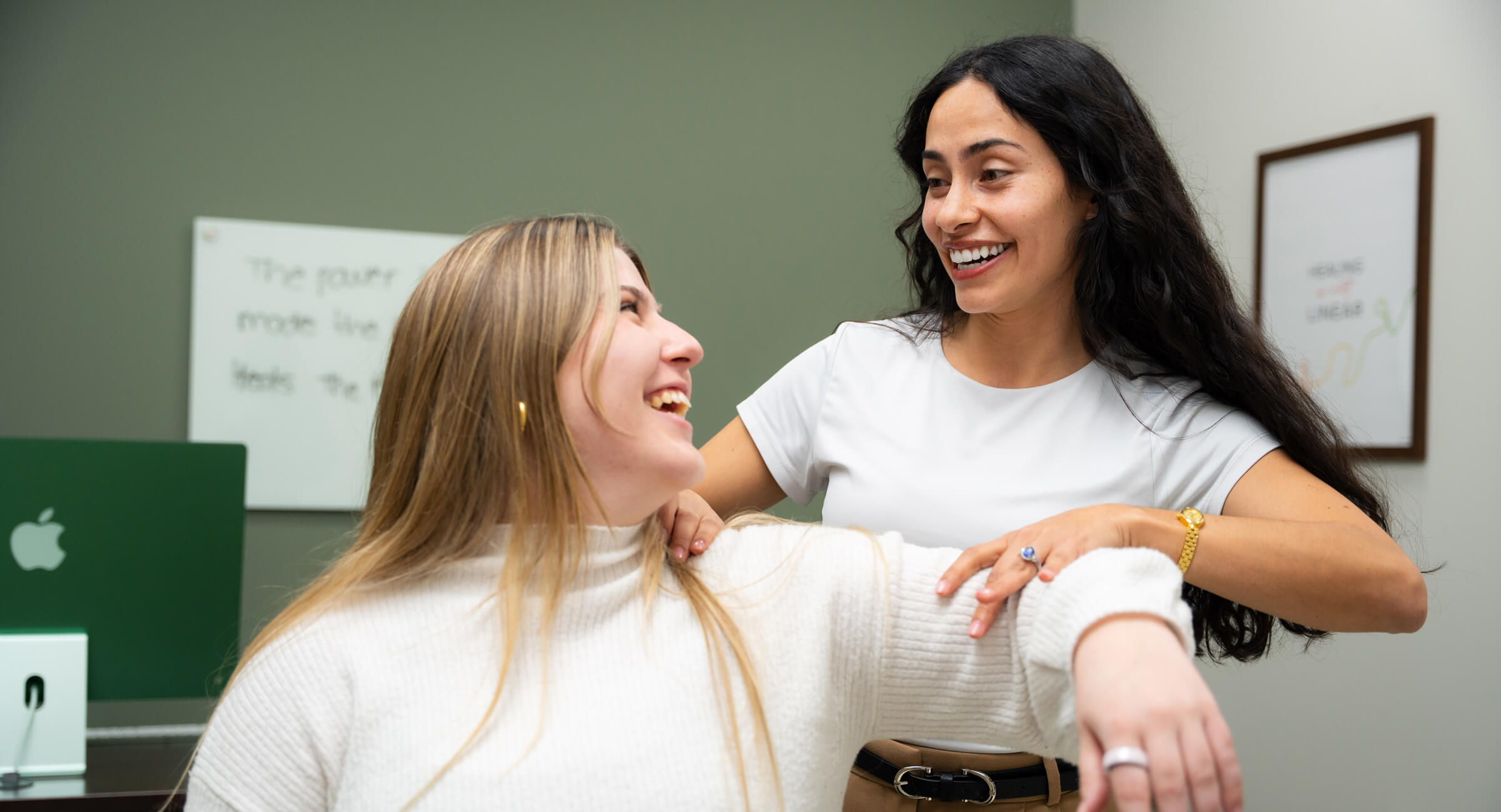 Holding woman's shoulder