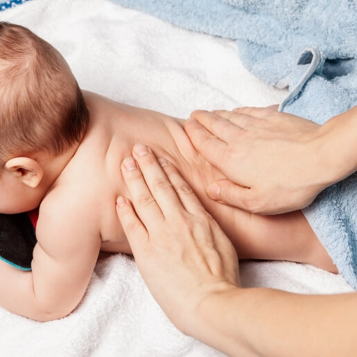 Chiropractor adjusting a pediatric patient