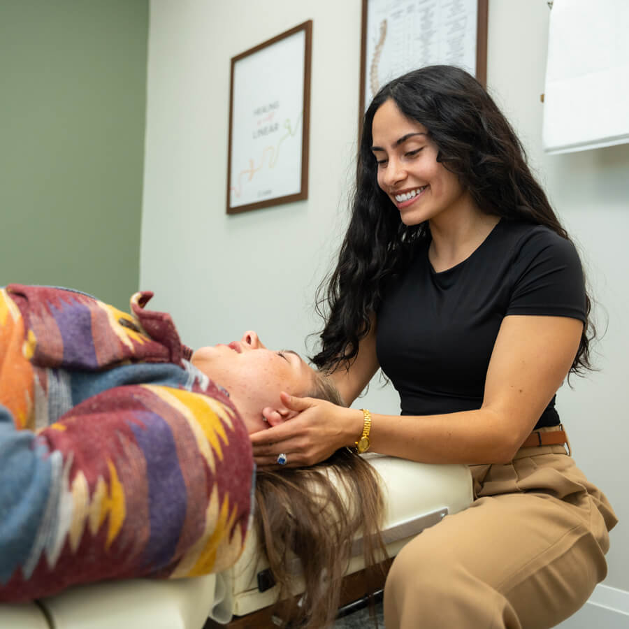 woman getting neck adjustment