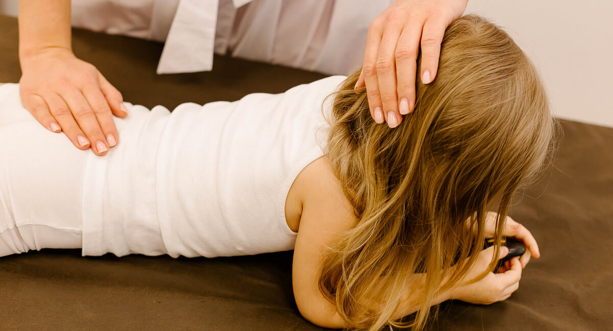 Young girl receiving a chiropractic adjustment