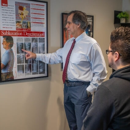 Dr Gavric showing patient a chart