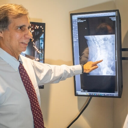 Dr Gavric reviewing patient xrays