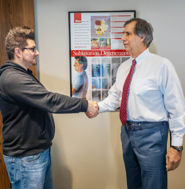 Oak Creek chiropractor Dr Gavric shaking patients hand