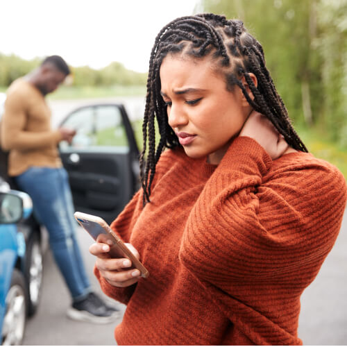 Woman with neck pain after car accident