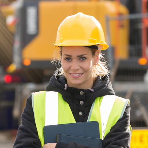 Smiling female construction worker