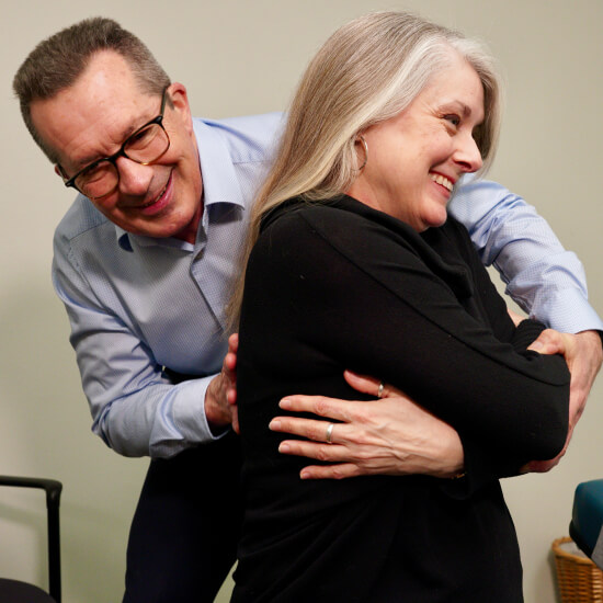 Seattle chiropractor adjusting a female patient's back