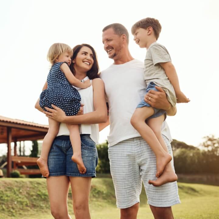 Smiling family of four