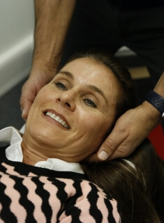 East Horsley chiropractor treating patient with a cranial adjustment