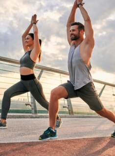 Sporty couple exercising outdoors