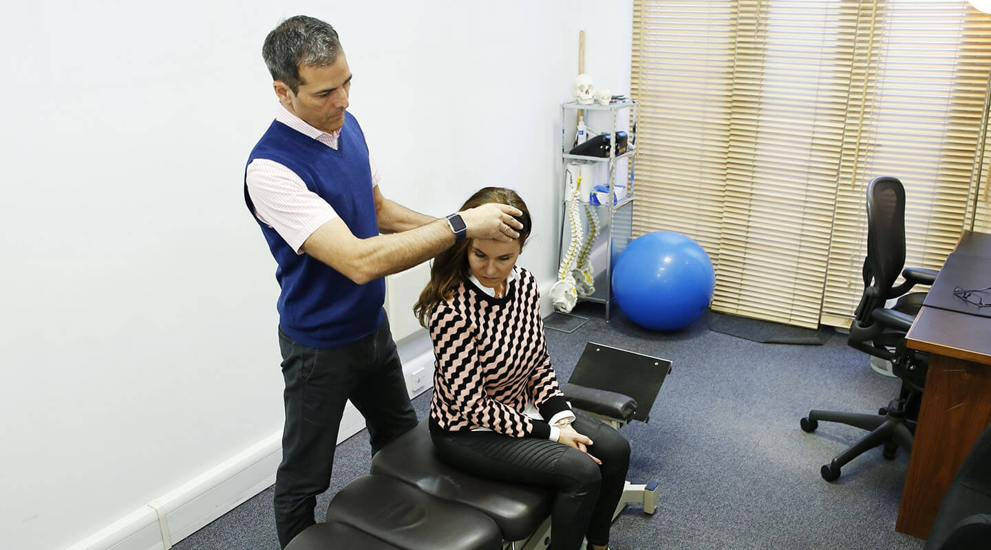 East Horsley patient receiving a cranial adjustment