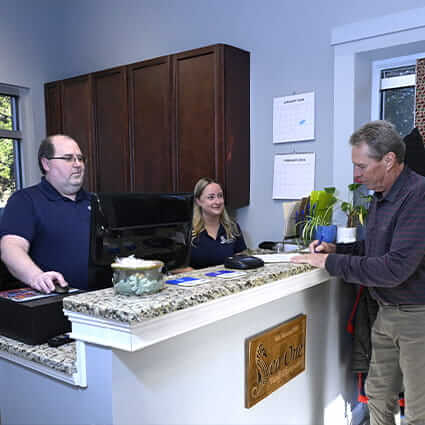 Patients checking in at front desk