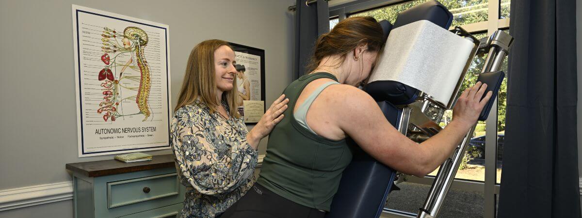 Female patient treat with physical therapy at Sea One Family Chiropractic