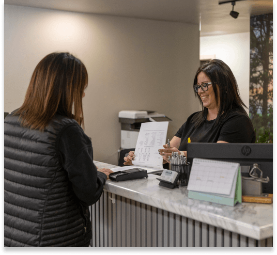 Key City Chiropractic & Acupuncture office team welcoming patient at front desk