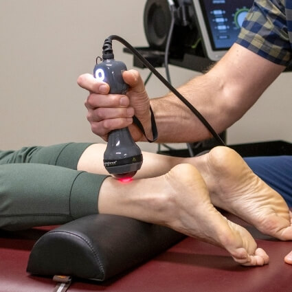 Laser treatment on Key City Chiropractic & Acupuncture patients ankle