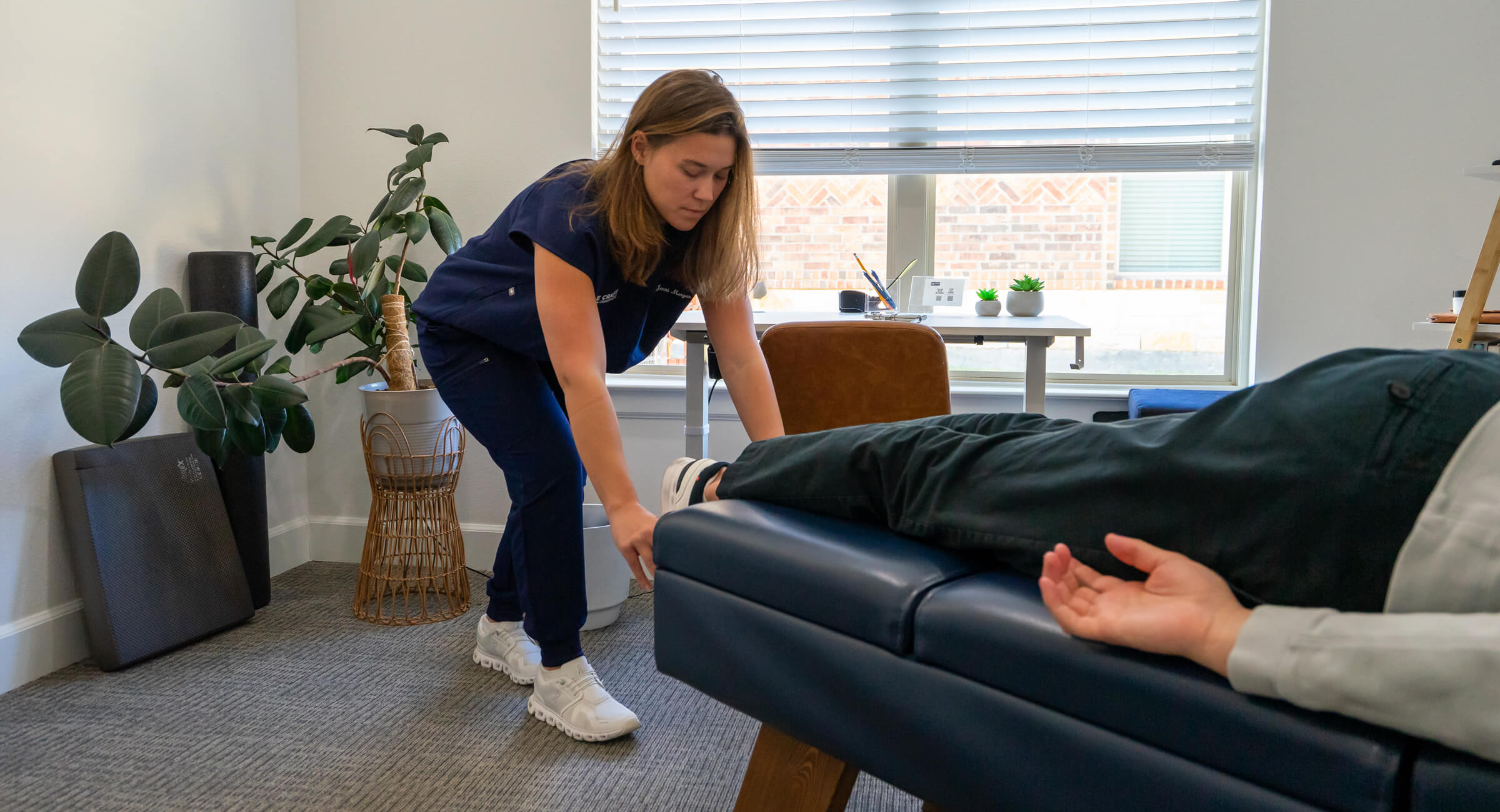 Dr. Jenni checking patient's ankles
