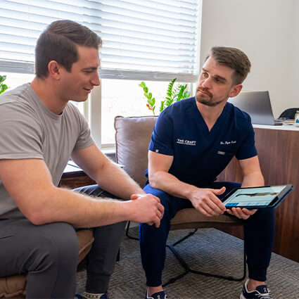 Frisco Chiropractor consulting with patient