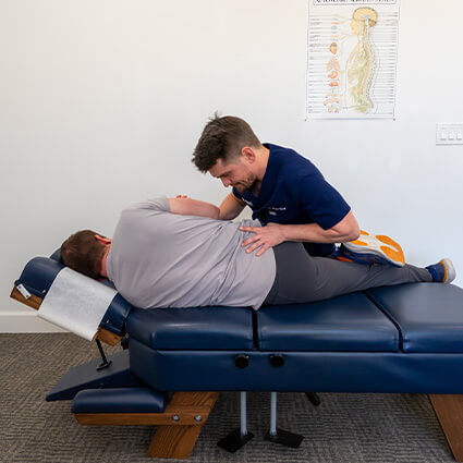 Adjusting man's back