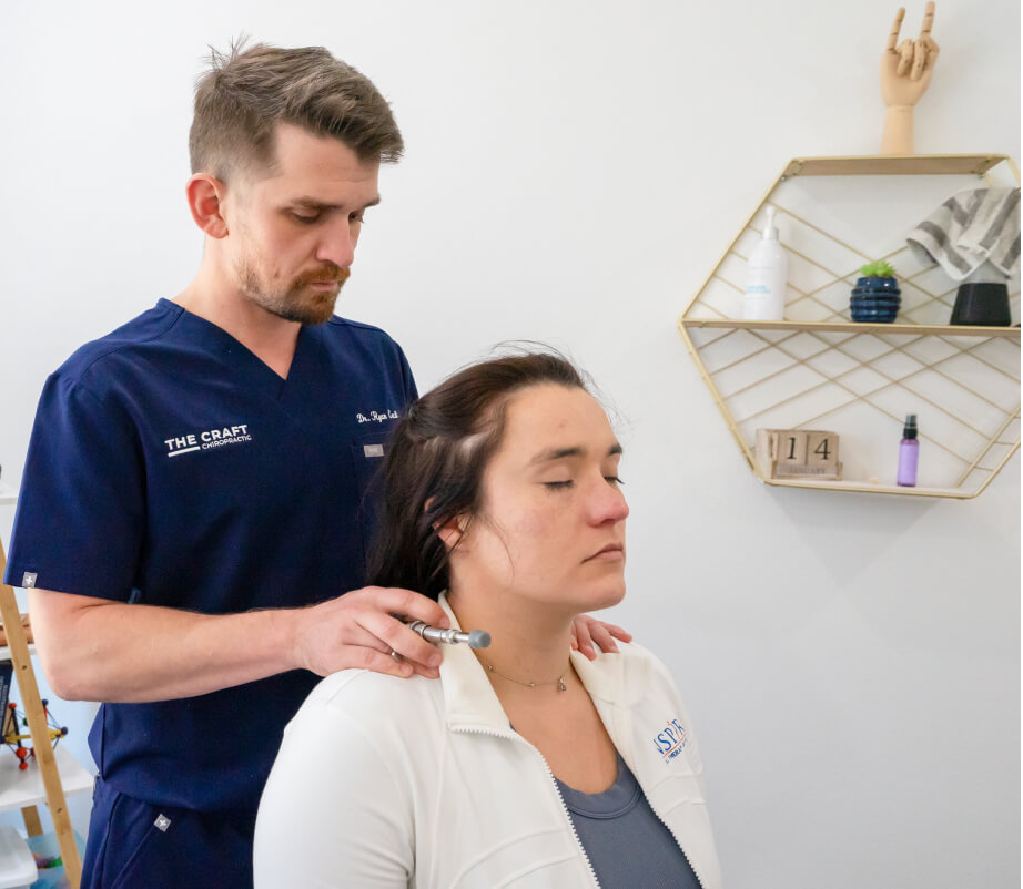 Chiropractor adjusting patient