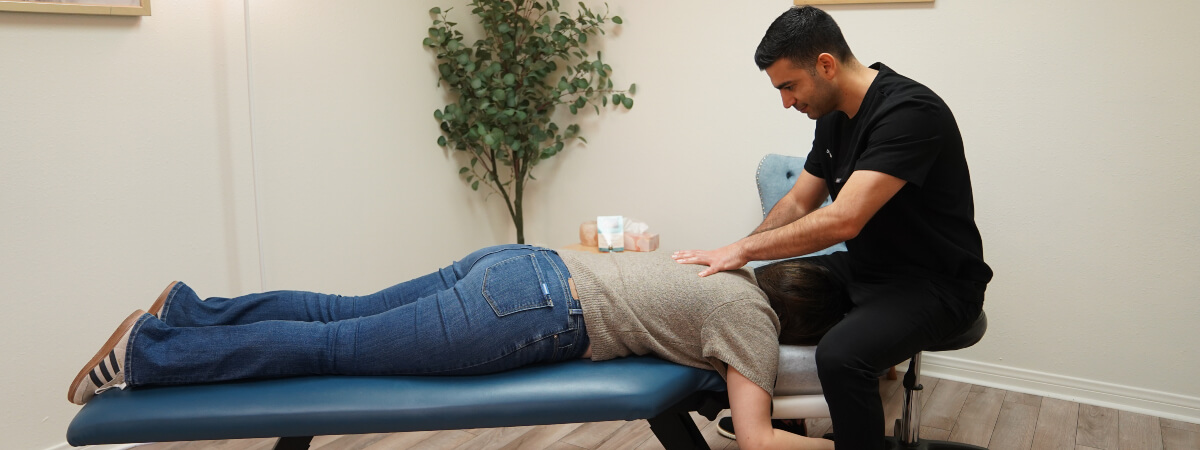 Costa Mesa chiropractor Dr. Kody adjusting a patient's back