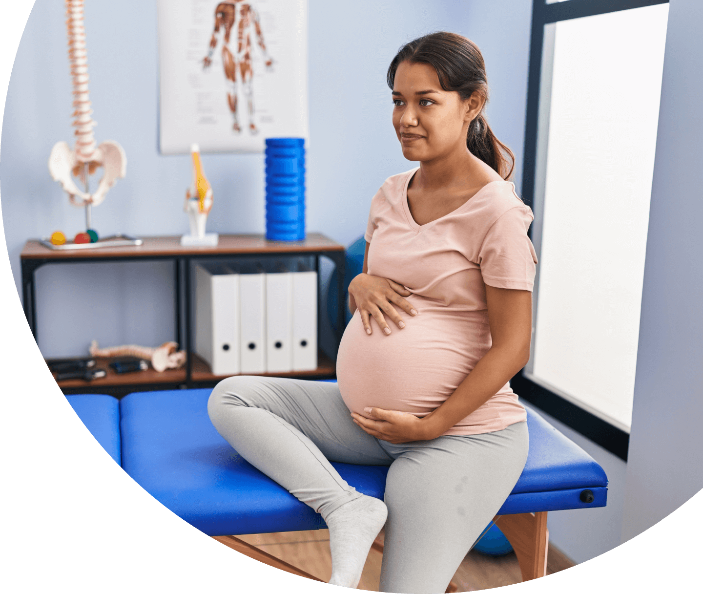 pregnant woman sitting on adjusting table