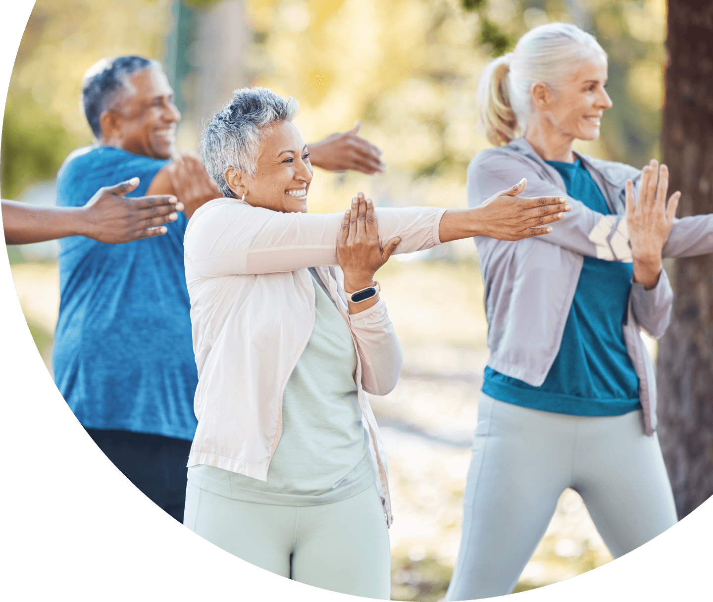 people stretching outdoors together