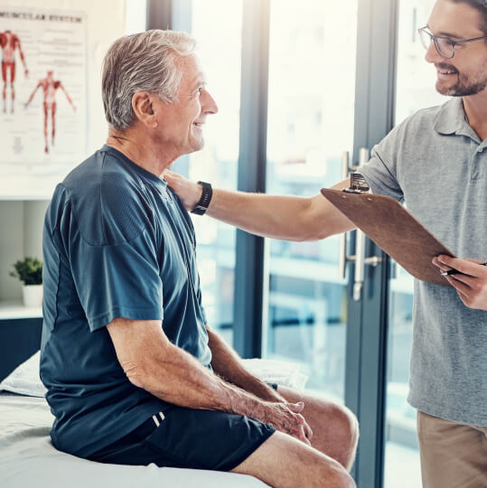 man talking with a chiropractor