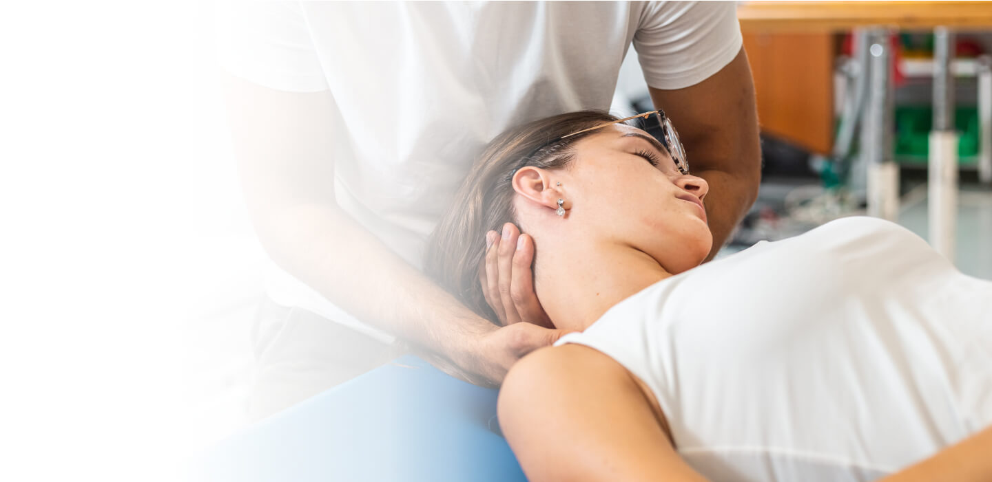 woman on adjusting table having neck adjusted