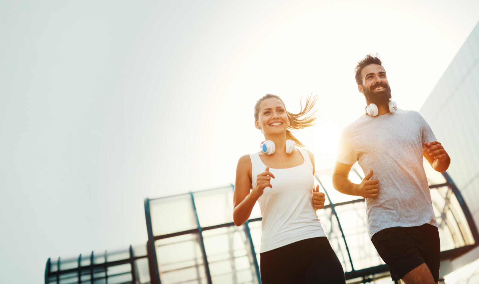 Smiling male and female joggers
