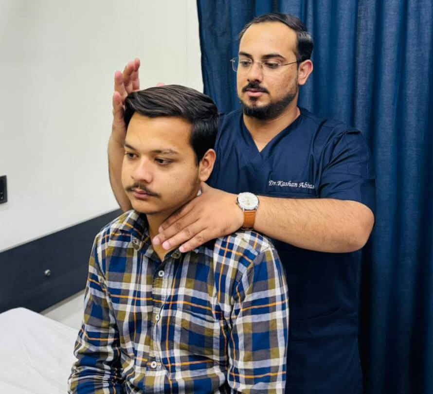 Cork chiropractor adjusting a male patient's neck