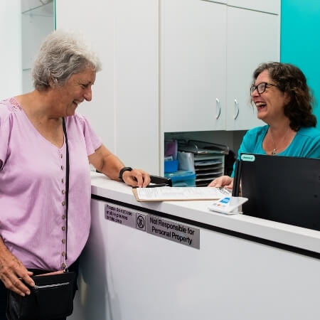 Patients checking in at front desk
