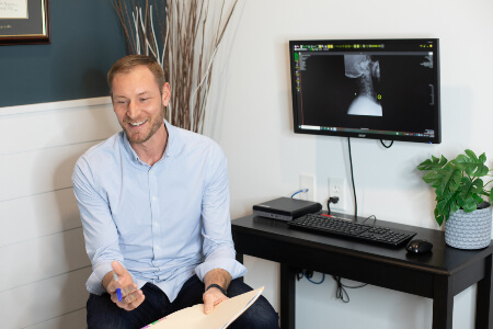 Burlington chiropractor in a consultation with a patient