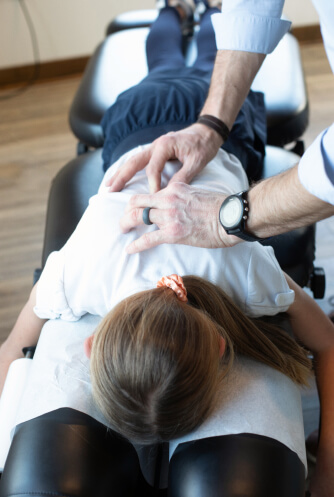 Burlington chiropractor adjusting a little girl