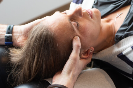 Burlington patient receiving a gentle neck adjustment