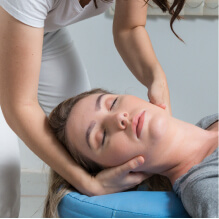 woman having back adjusted