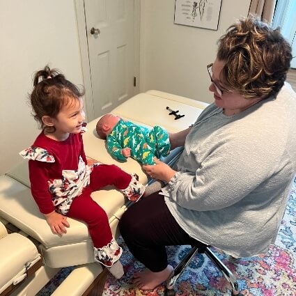 Arlington chiropractor Dr Alexia adjusting a baby