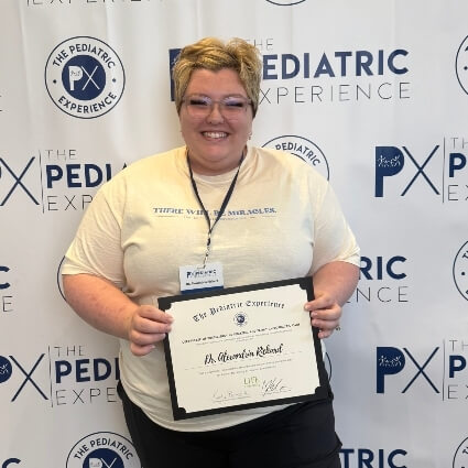 Dr Alexia accepting a certificate