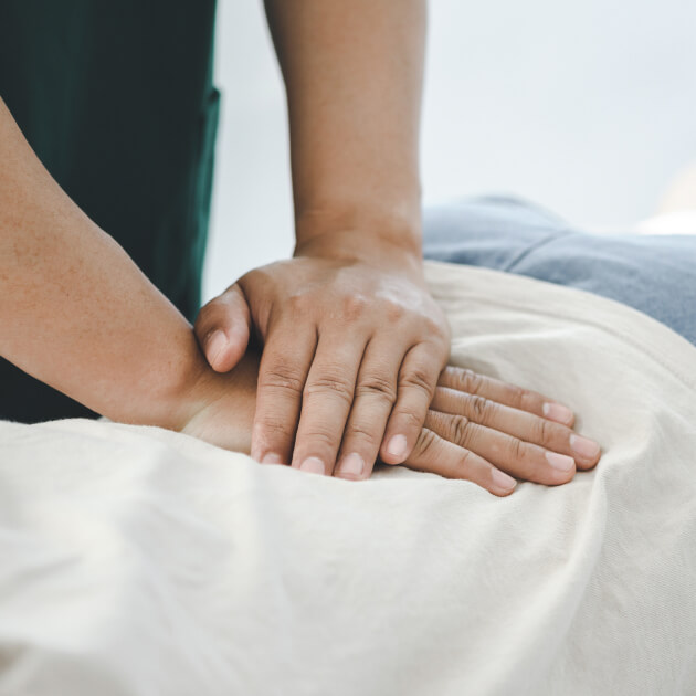 person having their back adjusted