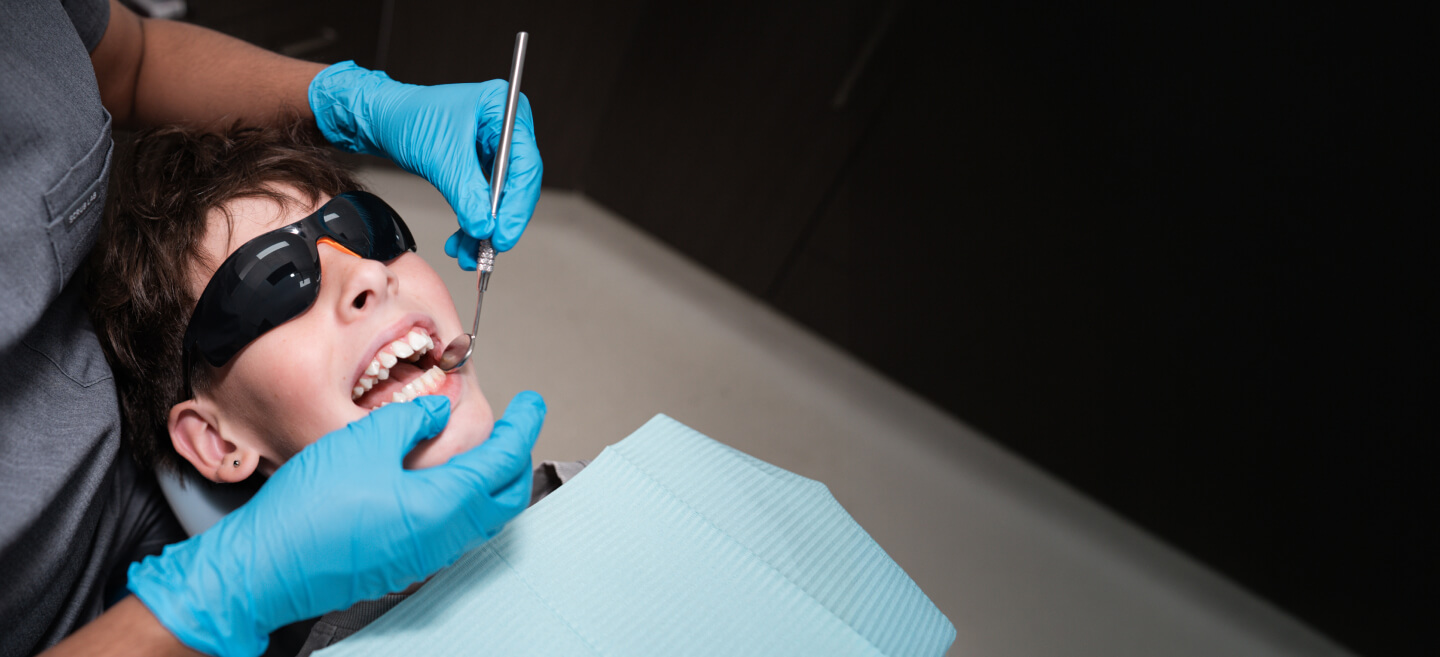 Little boy receiving a dental exam at Croydon Dental Clinict