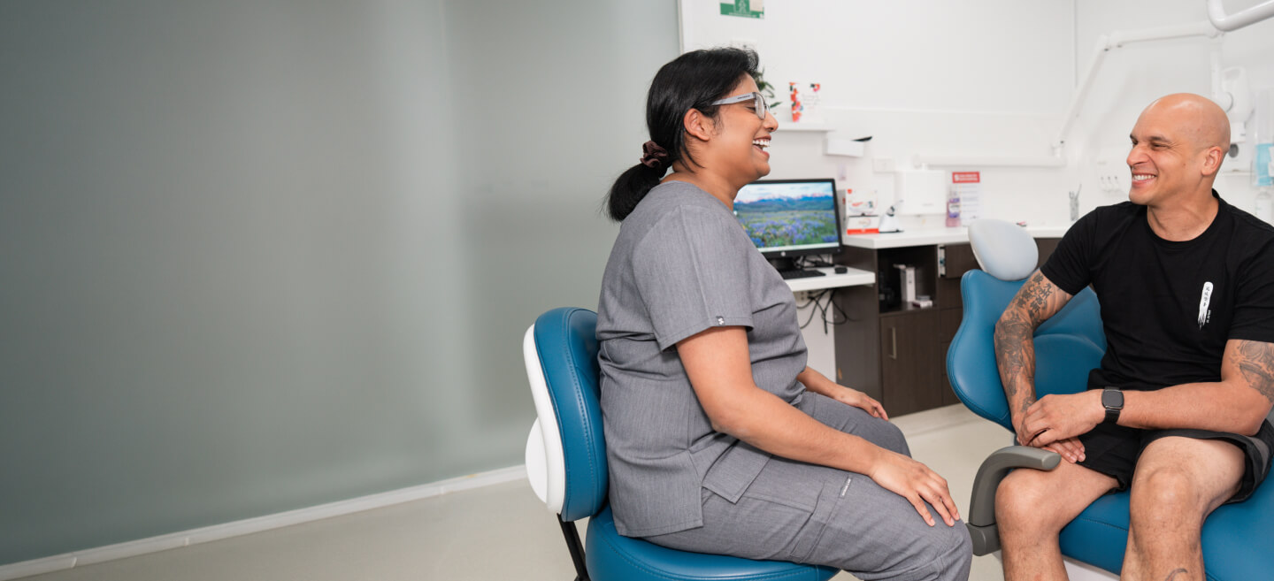 Smiling male patient in a dental consultation