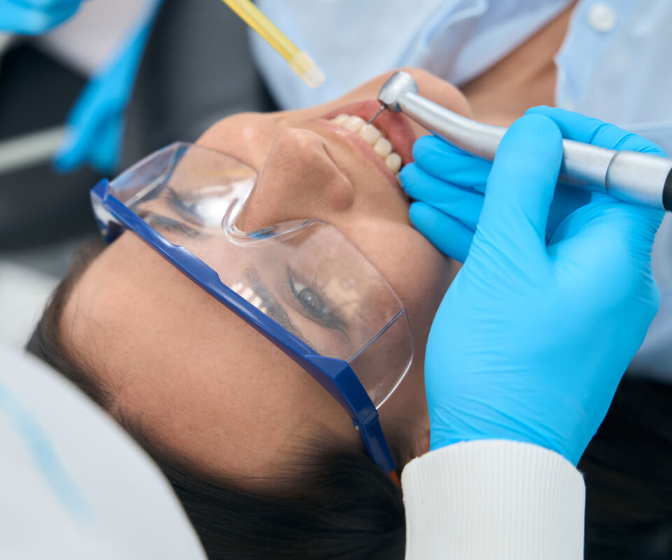 Dentist performing a Root-canal on a patient