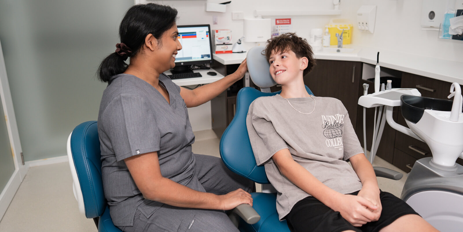 Croydon child patient talking to a dentist